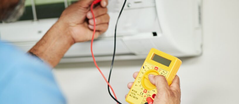 Multimeter, electrician and test for power, electricity or energy inspection on electrical box, sys